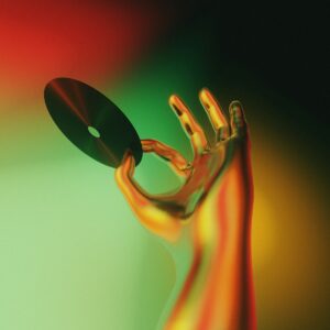 A blurry image of a hand holding a disc