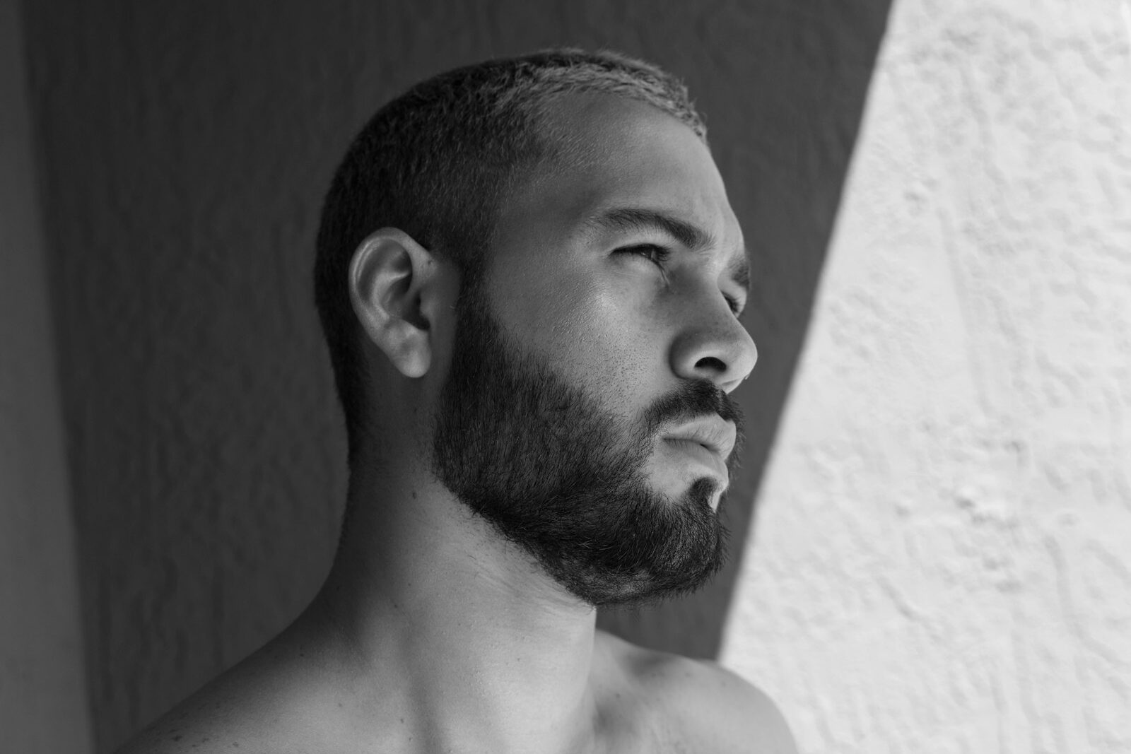 grayscale photo of topless man