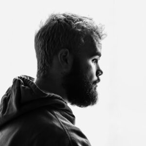 grayscale photo of man facing right